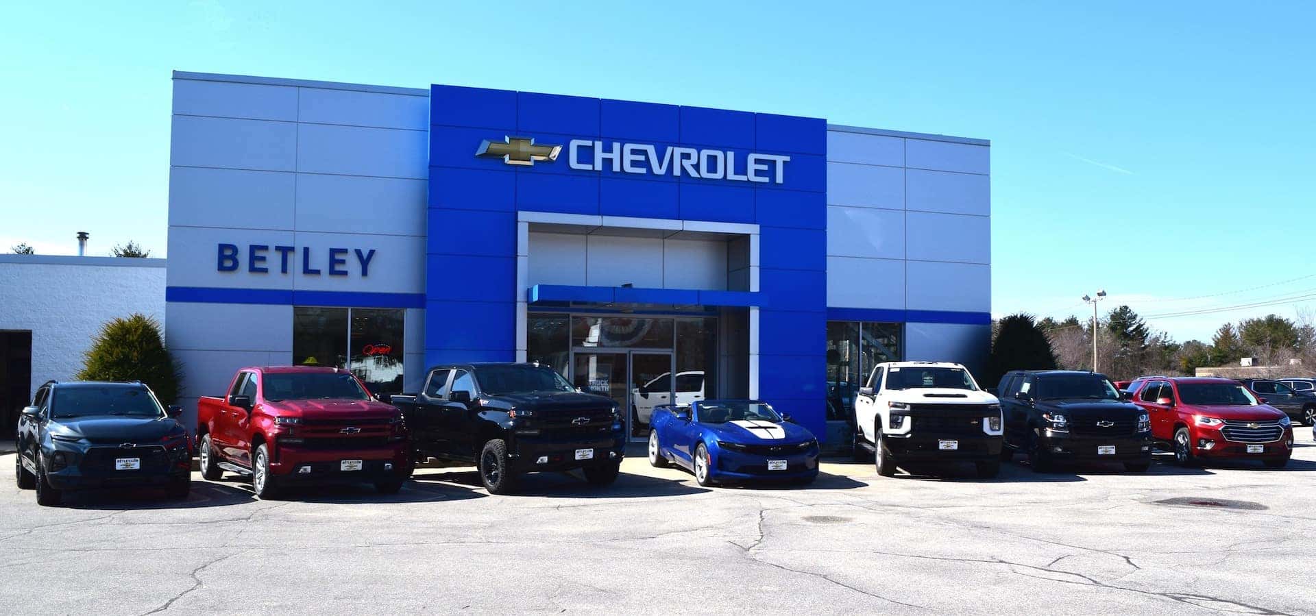 An exterior shot of a Chevrolet dealership at night.