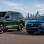 Green VW Atlas and blue VW Atlas Cross Sport with Chicago skyline in background