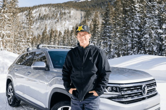 VW professional driver and vehicle in snow terrain demonstrating traction and control