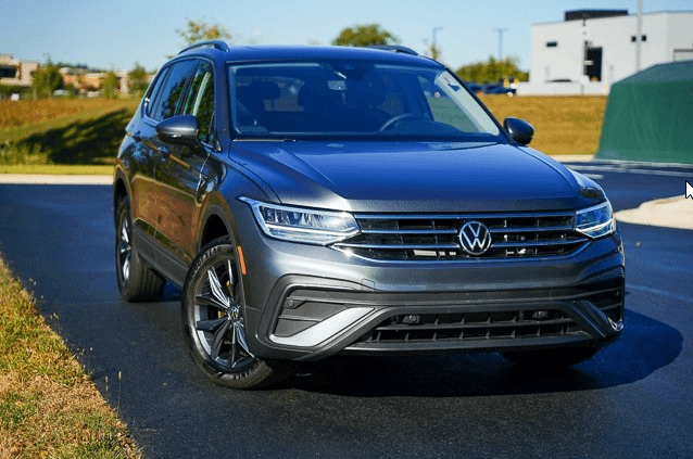 Used Volkswagen Tiguan SUV parked outside Elgin VW dealership