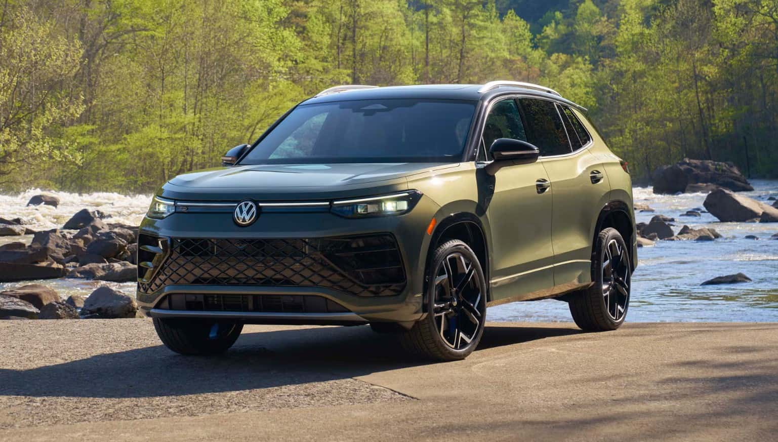 2026 Volkswagen Tiguan compact SUV parked near a river with updated exterior design and modern front styling