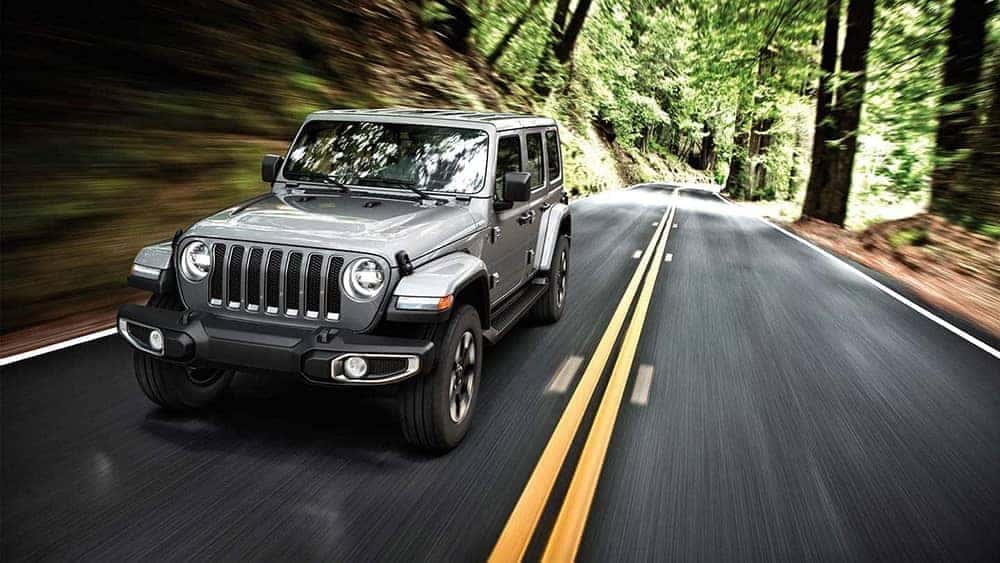 2019 Jeep Wrangler driving on forest road