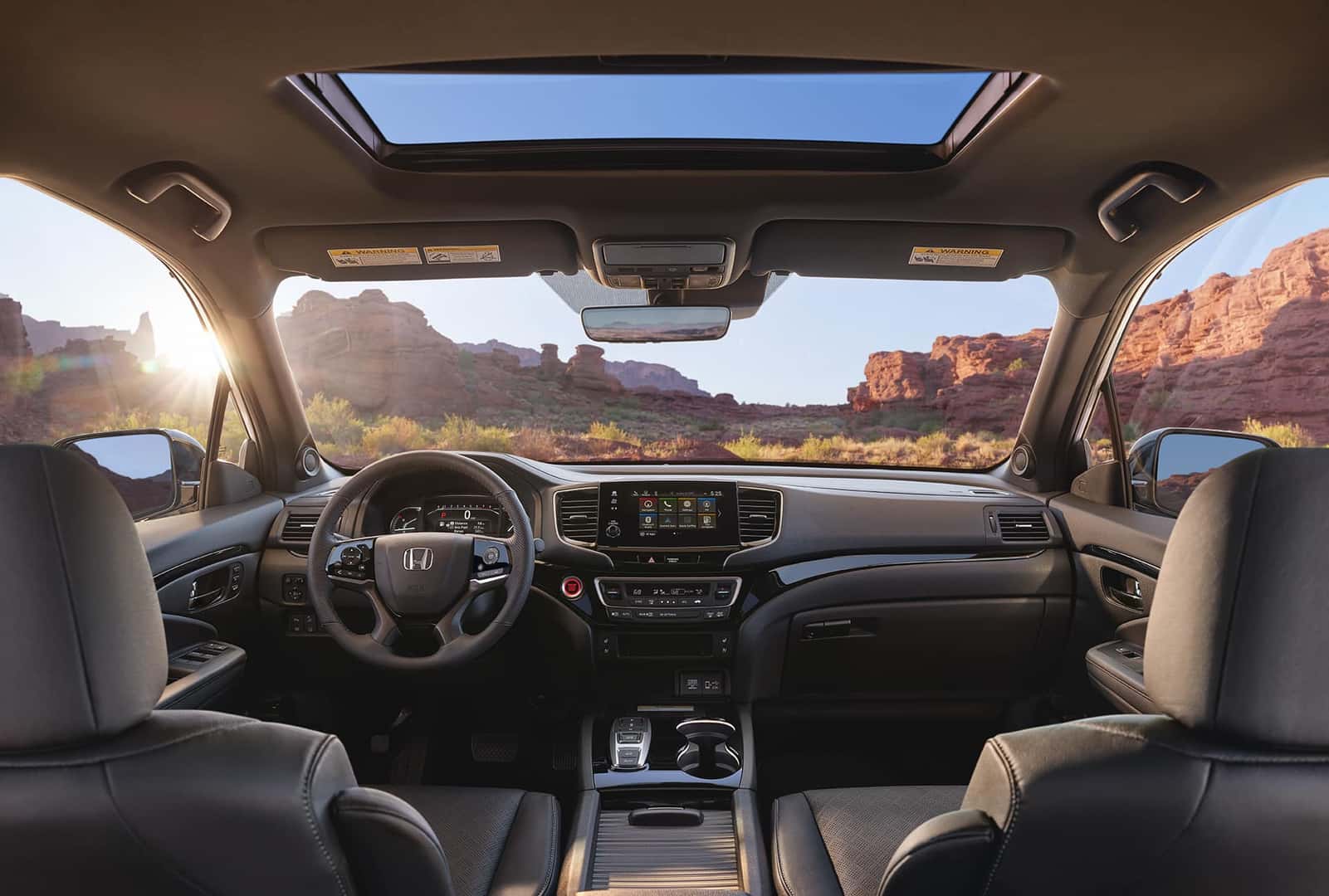 Interior shot of the 2022 Honda Passport looking through windshield to see mountains
