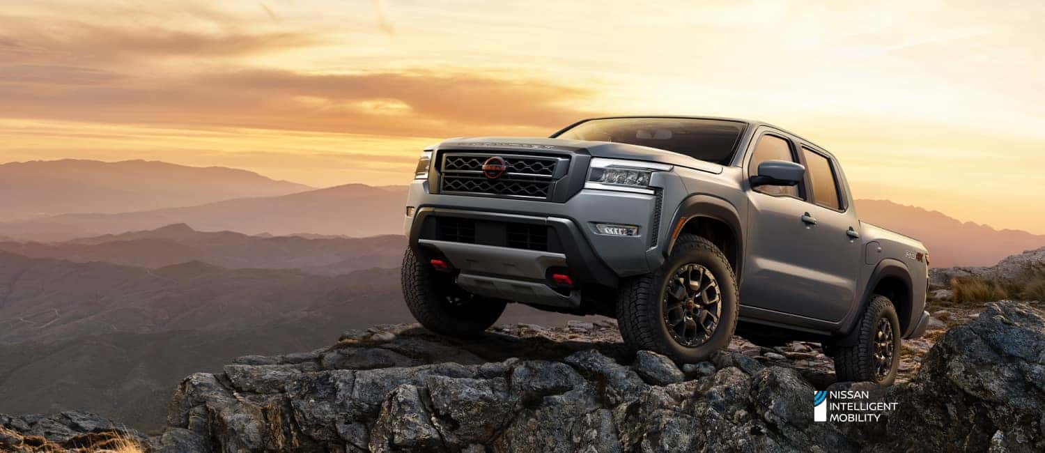Nissan Frontier climbing the rocky mountain terrain. 