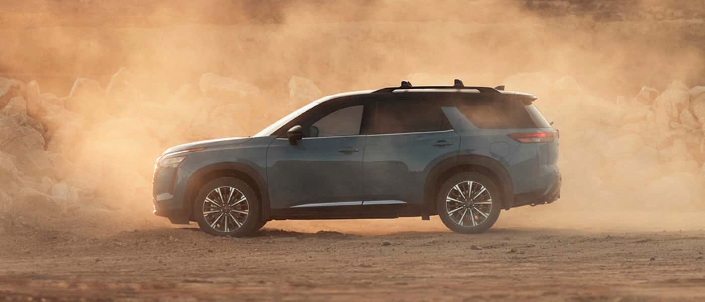 2026 Nissan Pathfinder Exterior Driving Through Dust