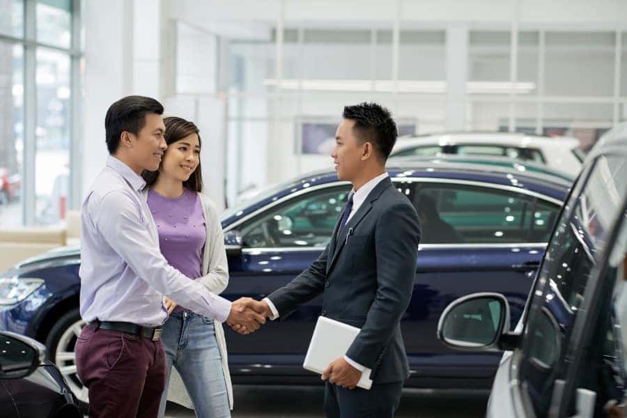 couple buying used car