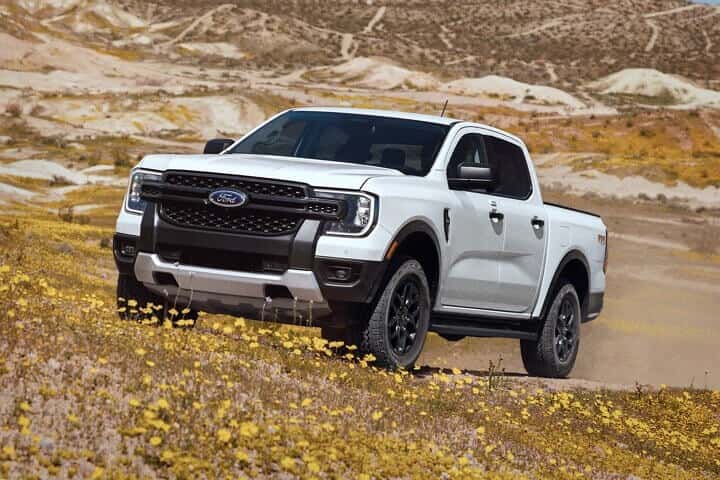 New Ford Ranger Driving up Dirt Road