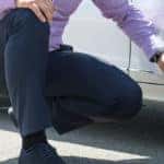 man pointing at mercedes-benz tire