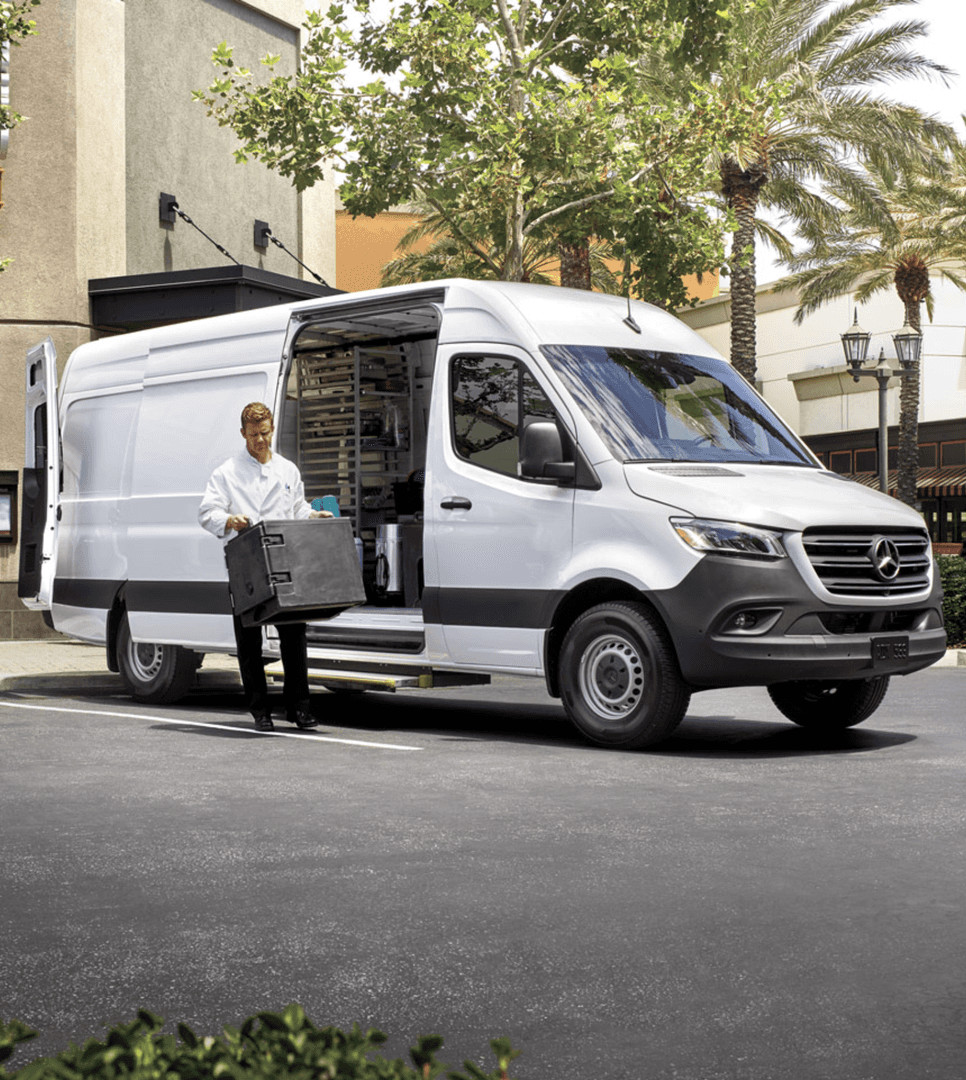 Catering employee removing deliveries from a white Mercedes-Benz Sprinter van - Section 179 Basics