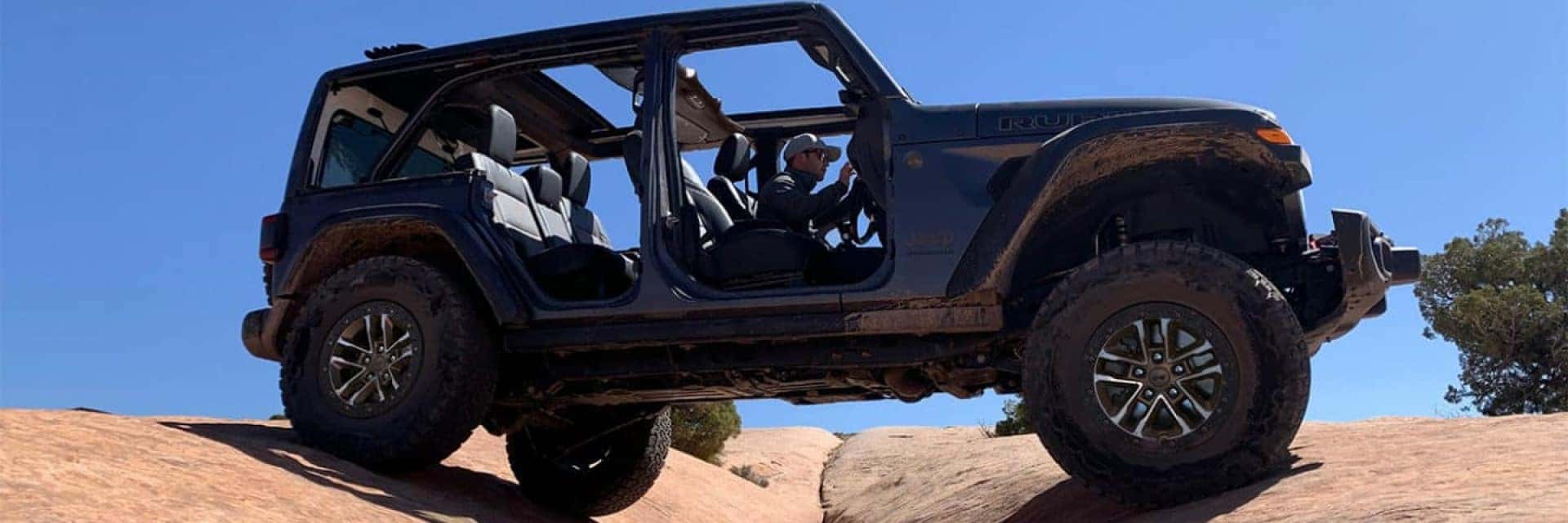 man driving jeep rubicon