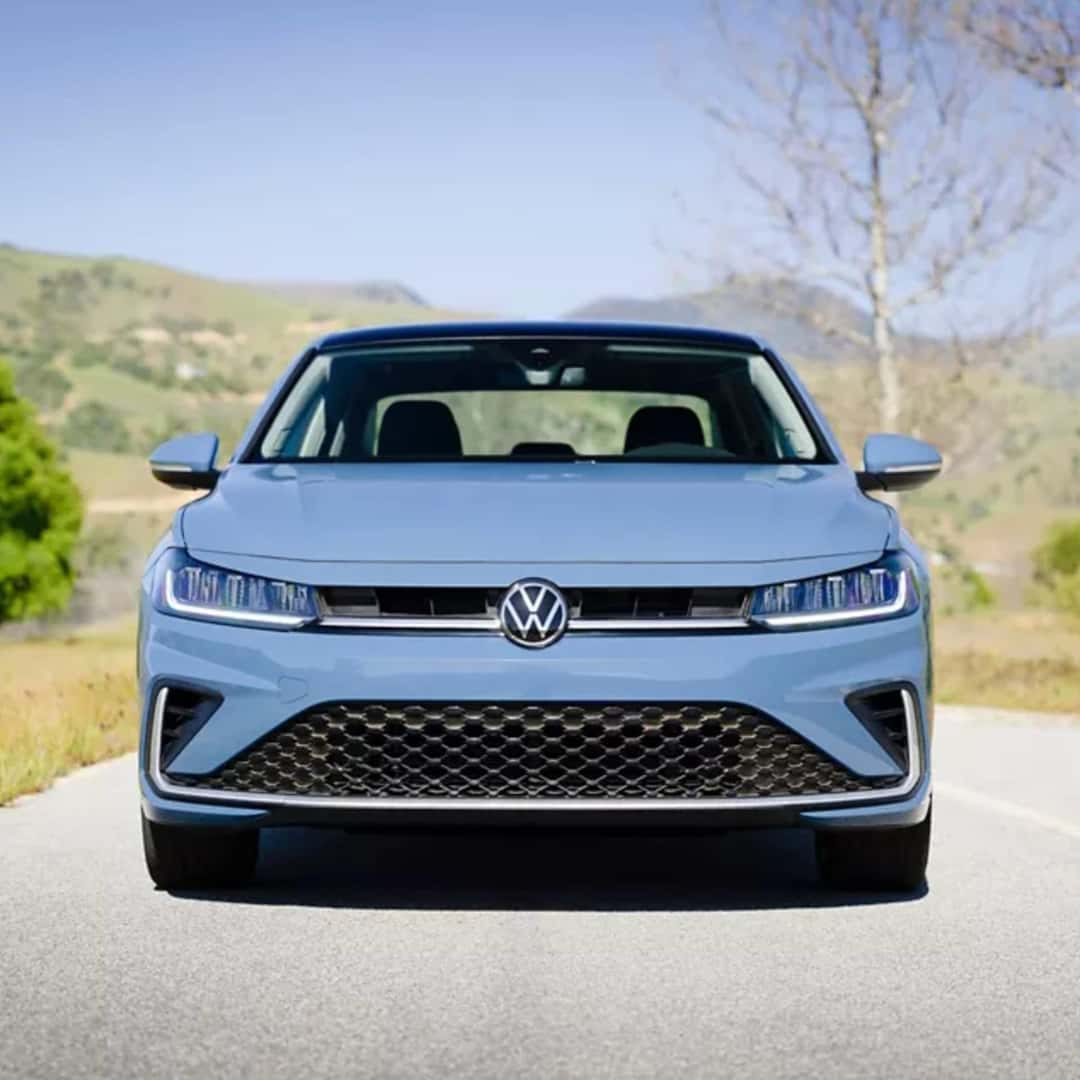 2025 blue volkswagen jetta driving on road