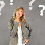Question Marks Around Woman Thinking