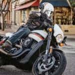 Harley Rider Turning Corner on Street