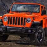 Orange 2019 Jeep Wrangler on rocky ground