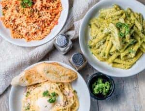 italian pasta on white ceramic plates