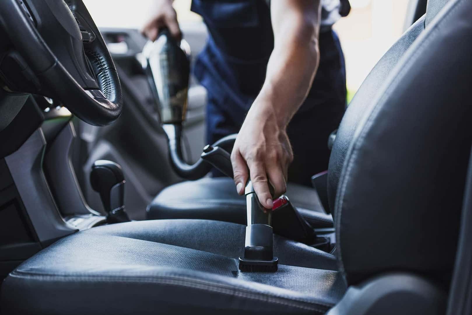 vacuuming interior of vehicle