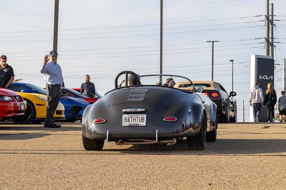 Black Classic Car Exiting Car Show