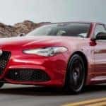 A red Giulia on a road