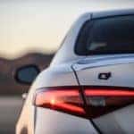 A closeup photo of a silver Alfa Romeo TI Sport the left rear tailight