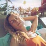 Woman sunbathing at the pool