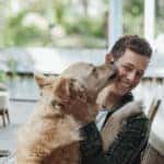 Dog licking their owner's face