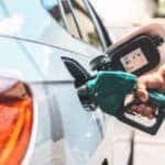 Detail of hand filling the fuel tank