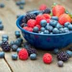 A bowlful of delicious organic berries. Strawberries, blackberries, blueberries and raspberries.