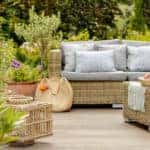 Modern designed terrace with wicker furniture and plants