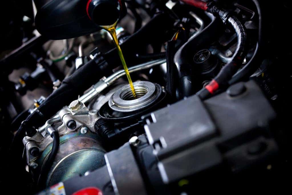 oil poured under hood of car