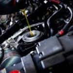 oil poured under hood of car