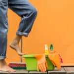 Woman with house supplies ready to clean room. Autumn cleaning.