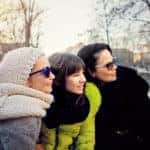 Mother and young daughters on a winter carriage ride