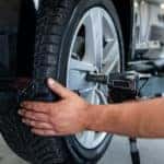 Mechanic changes a tire in a repair shop