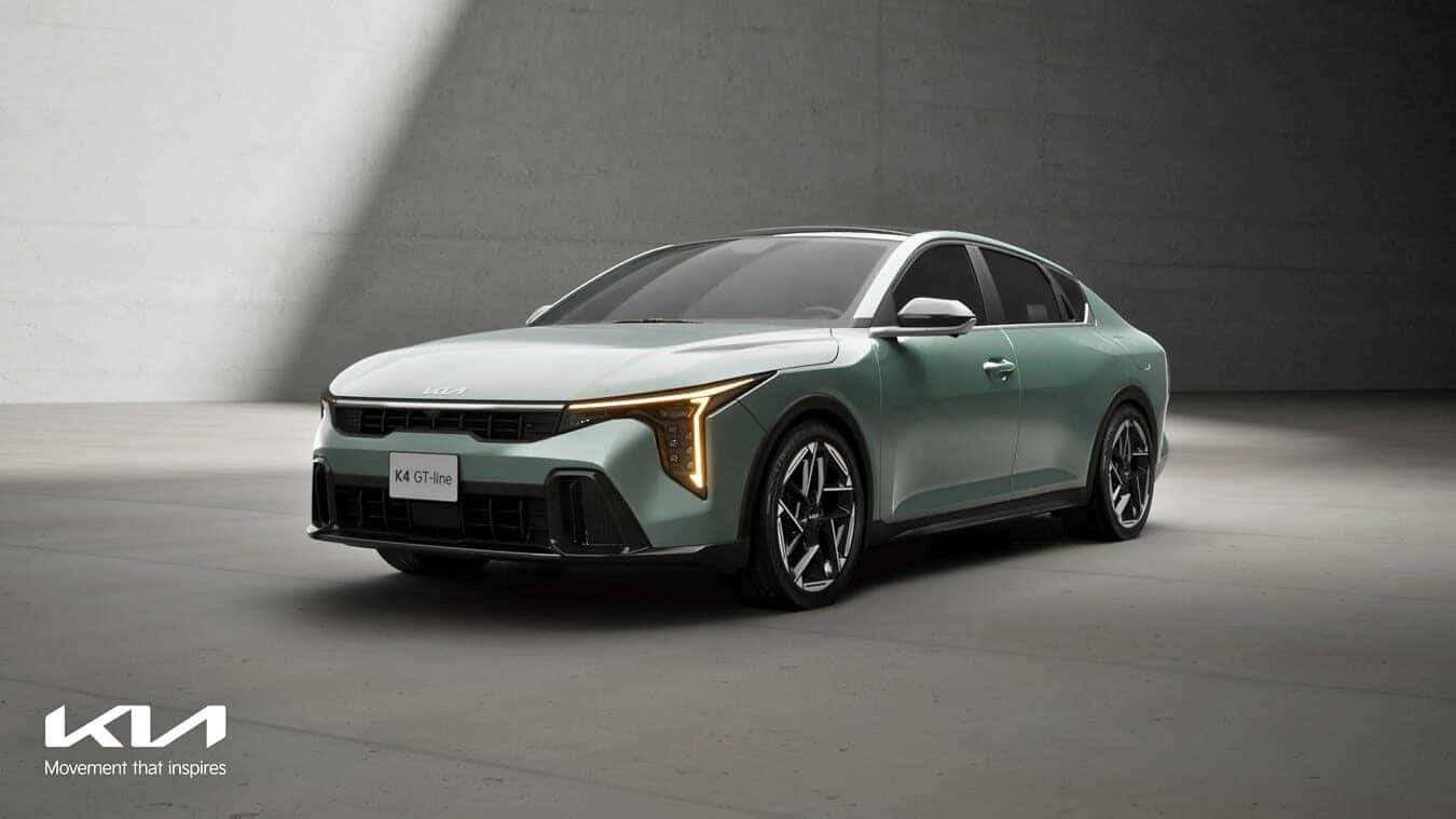 The new Kia K4 compact sedan is prominently displayed, showcasing its sleek design and modern features in this image.