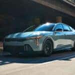 The all-new 2025 KIA K4 compact sedan displayed prominently, showcasing its modern design and innovative features.