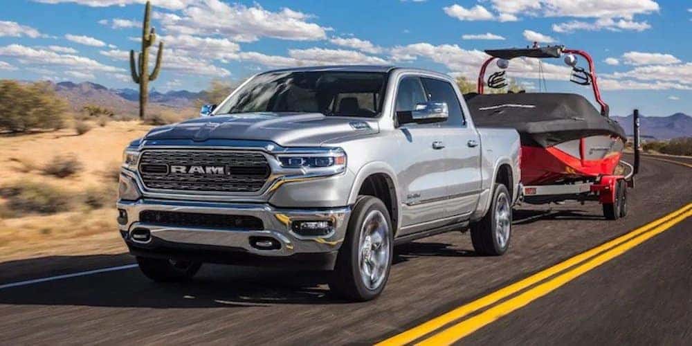 2019 ram 1500 towing boat on highway