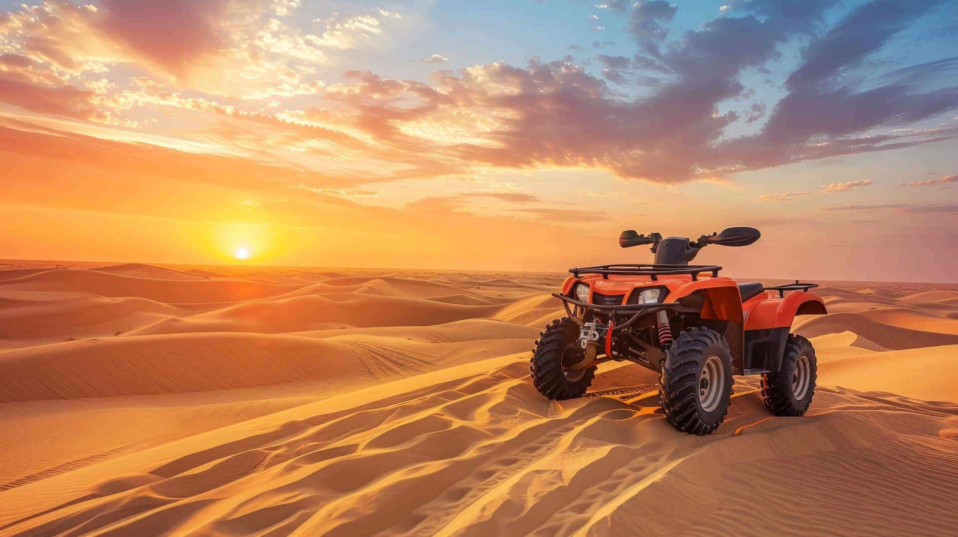 Off Roading ATV sitting atop sand dunes in the desert