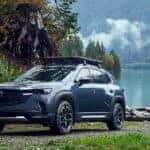 2025 Mazda CX-50 parked in front of a lake