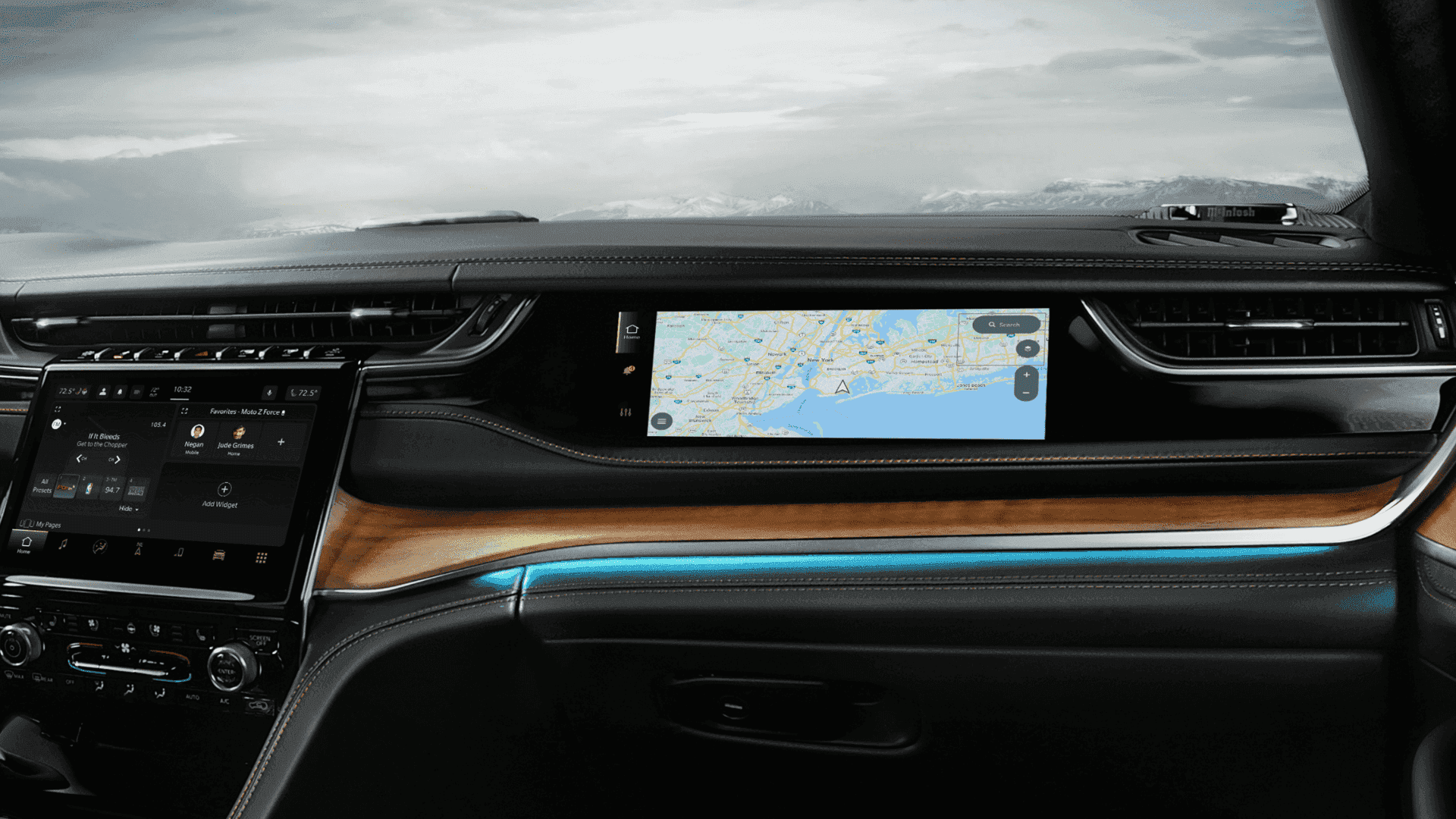 Interior of 2025 Jeep® Grand Cherokee with wood trim and dual digital displays