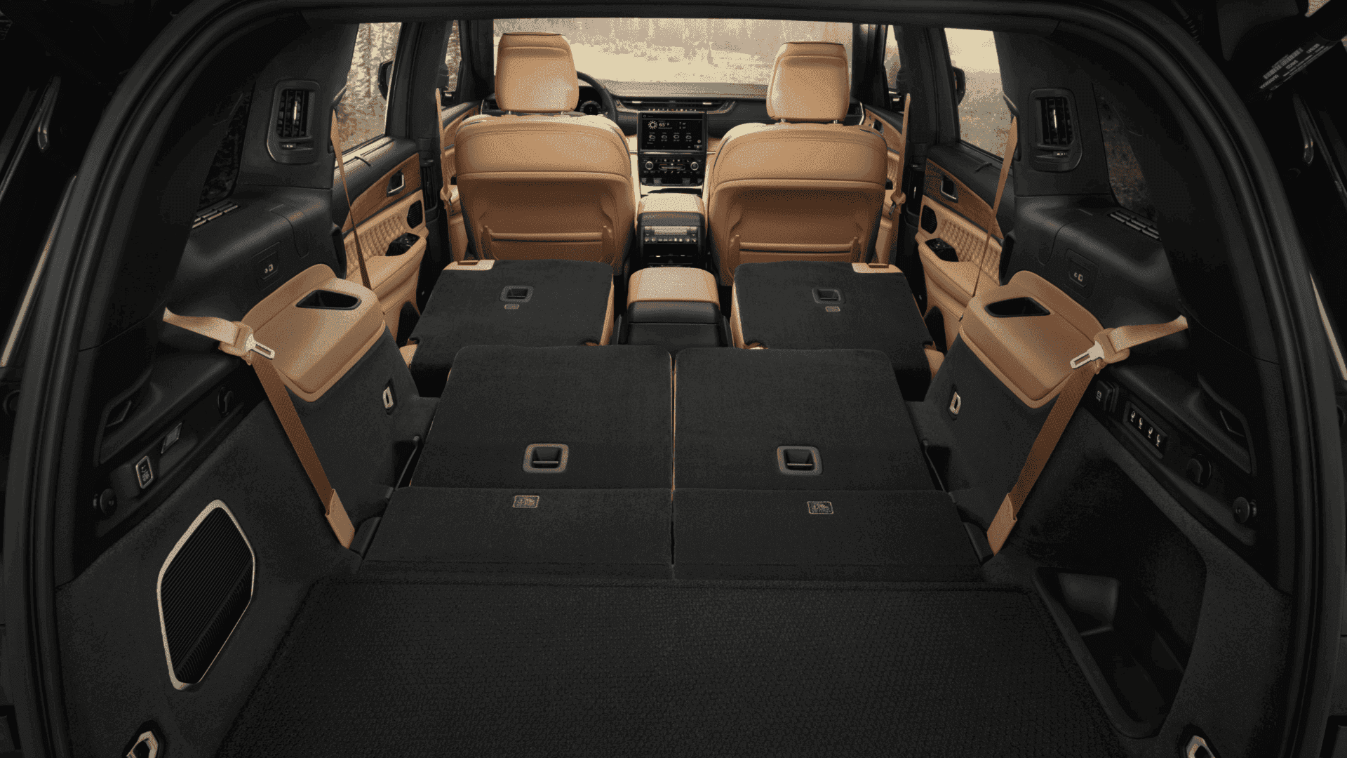 2025 Grand Cherokee L with seats folded flat, viewed from rear to front of the cabin