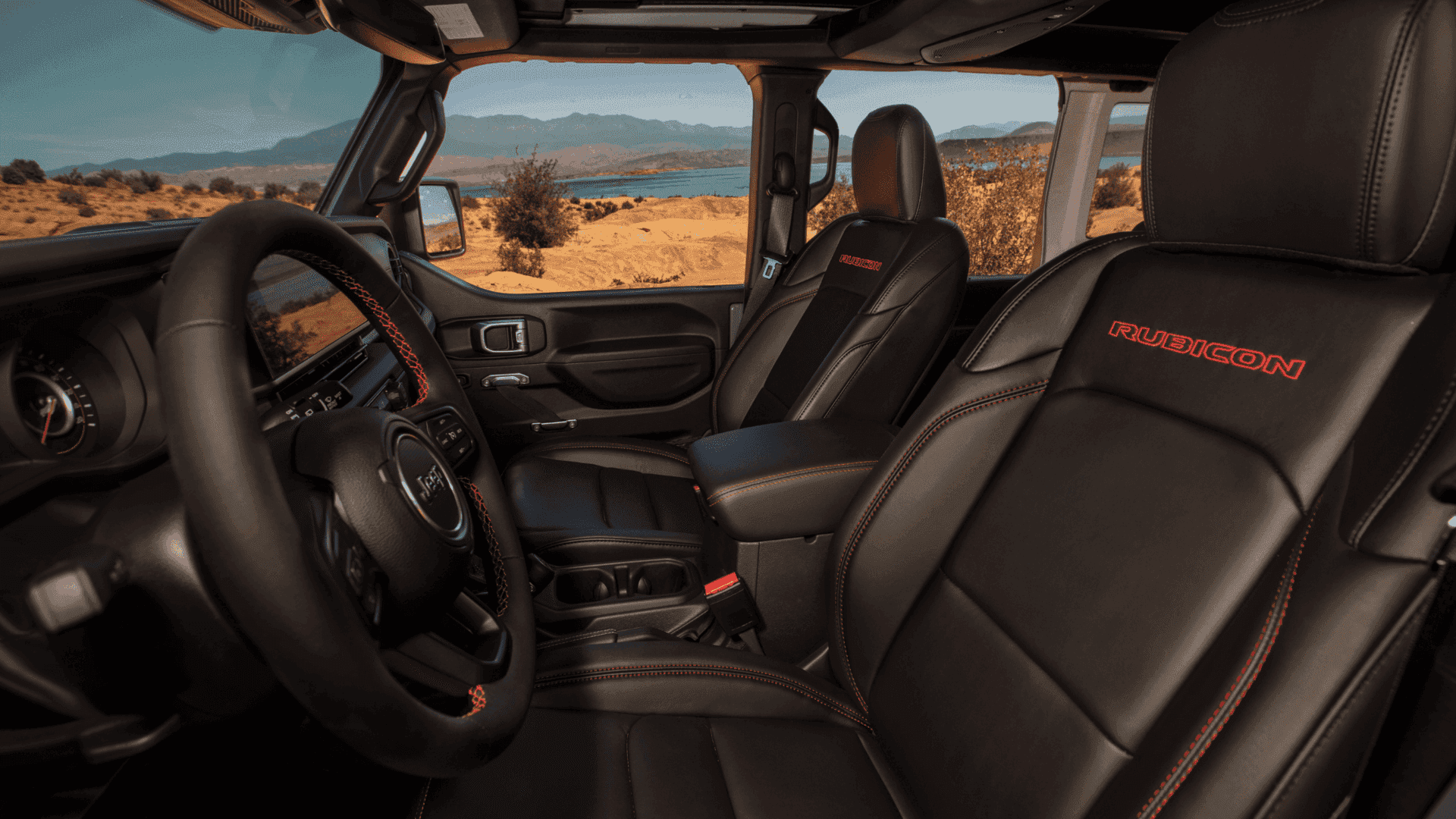 2025 Jeep Wrangler Rubicon interior with black leather seats and red stitching