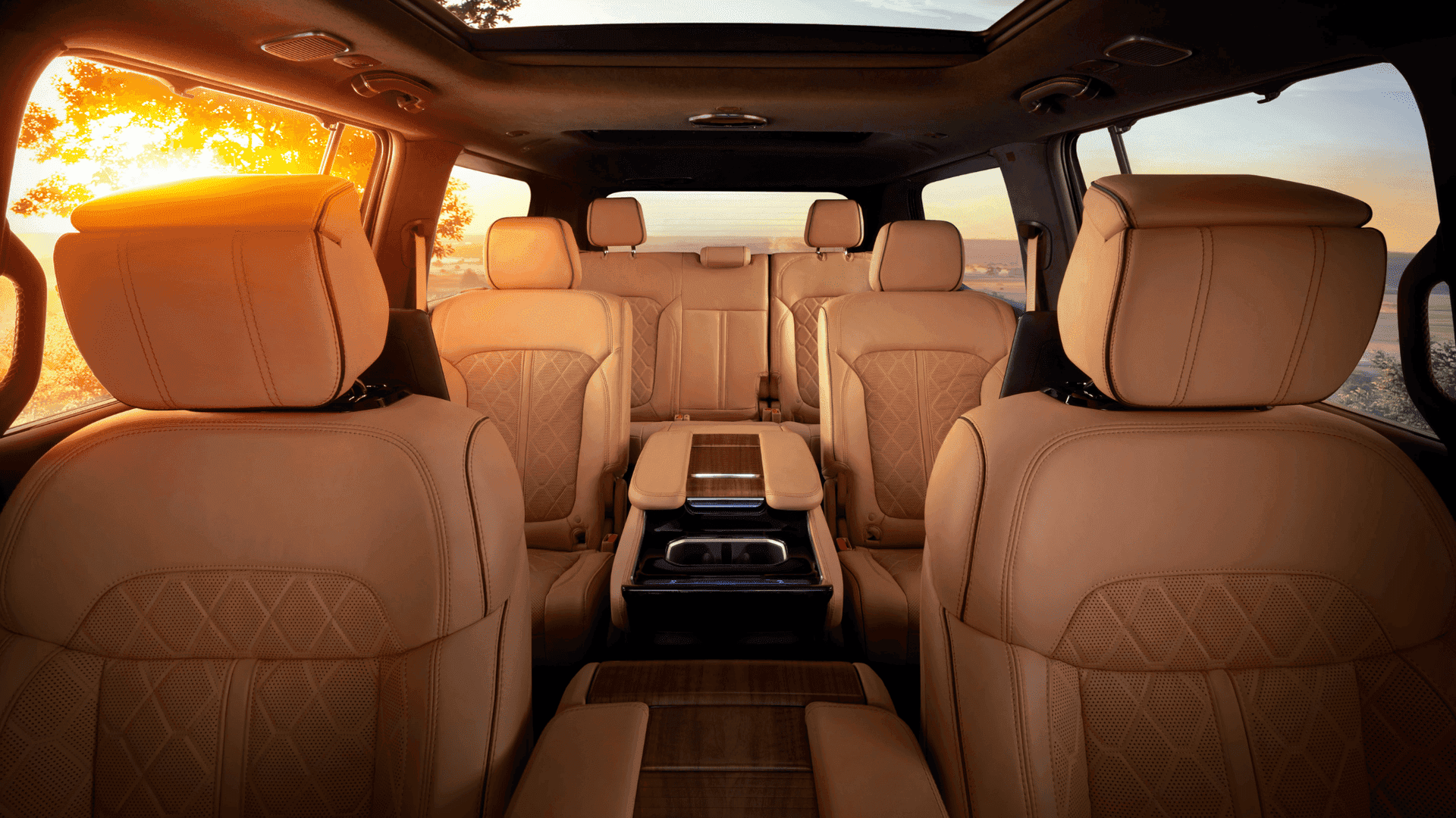 Three-row interior of 2025 Grand Wagoneer with premium quilted leather seats at sunset