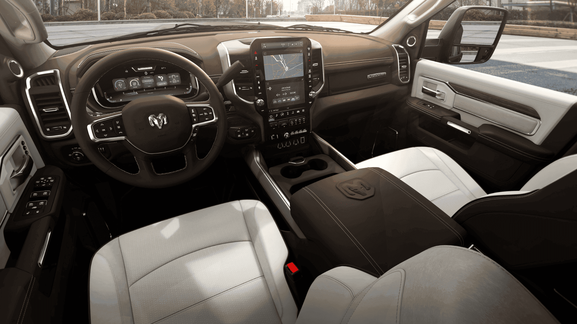 2025 Ram 3500 Laramie front cabin with two-tone seats, touchscreen, and premium trim.