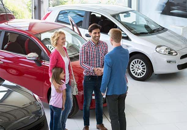 Family in Dealership Showroom
