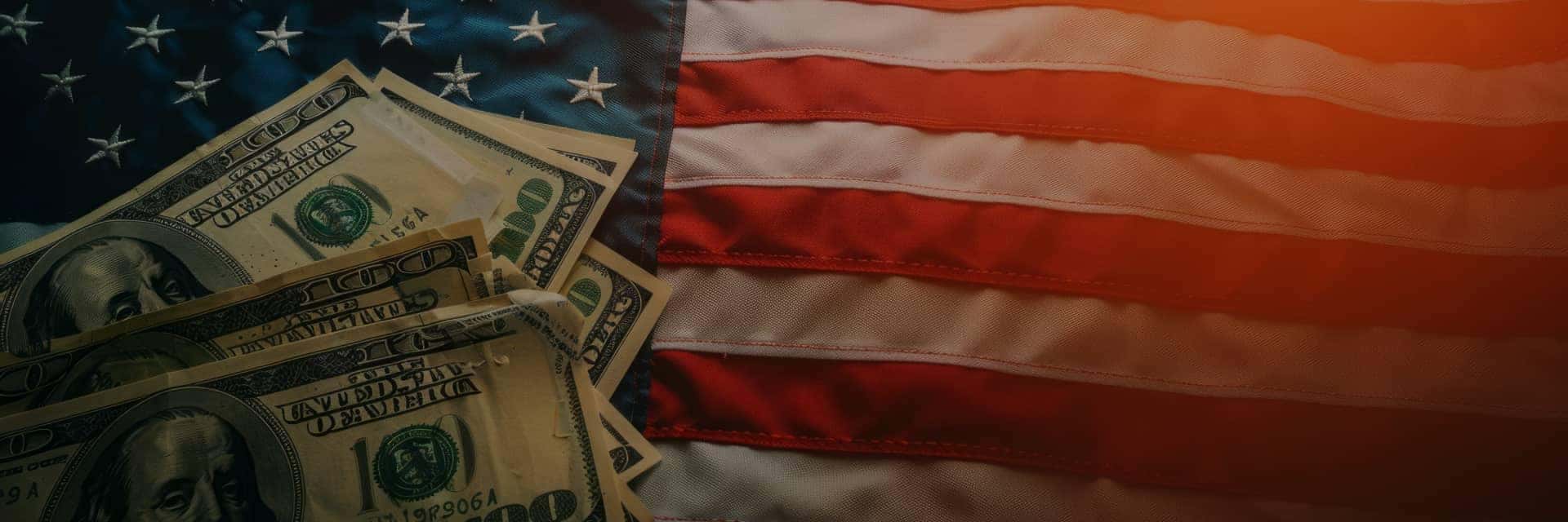 stylized american flag with $100 bills laying on top on the left side