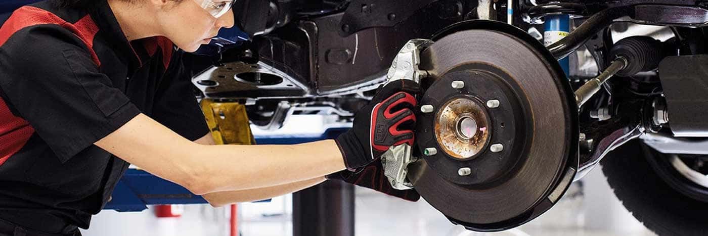 Toyota mechanic replacing brake pads