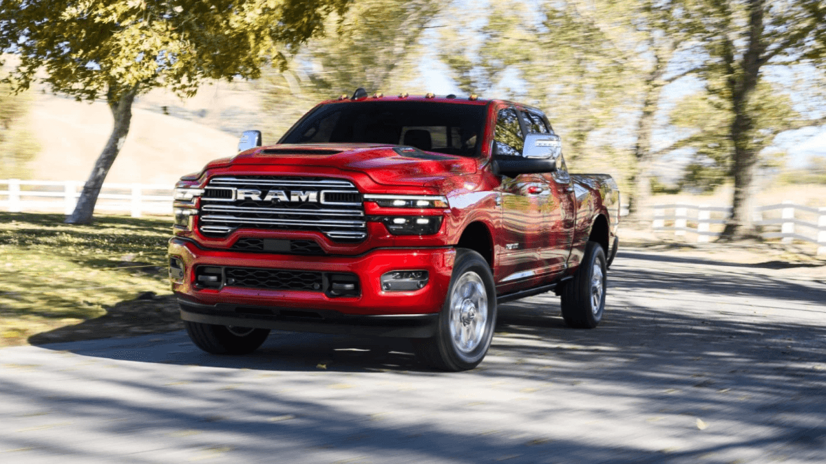 A red RAM 2500 driving down a road