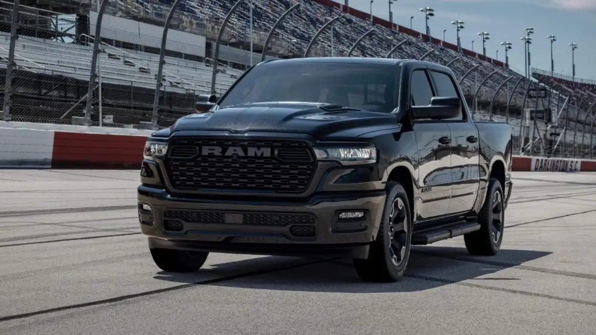 A black RAM 1500 on a race track