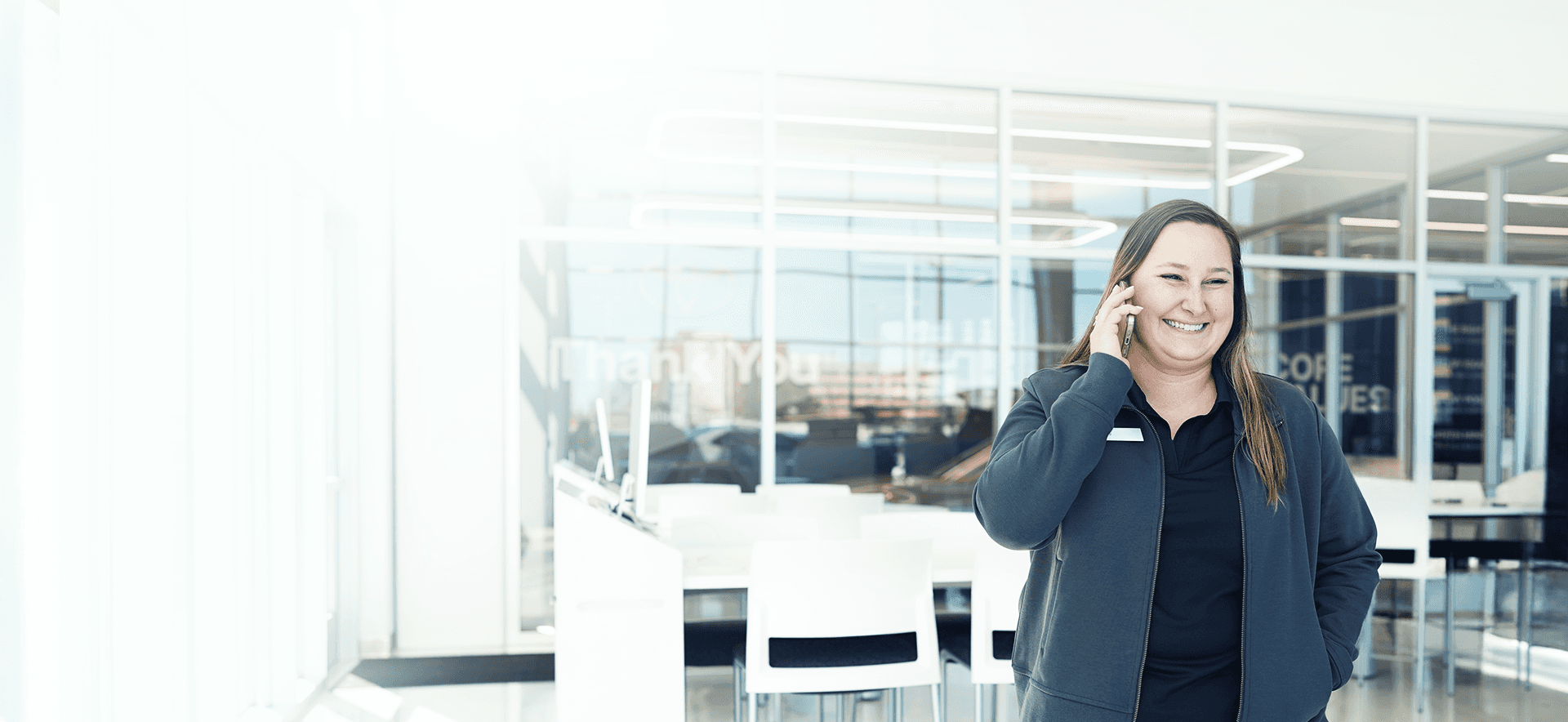 Walser Salesperson smiling talking on the phone to a customer.