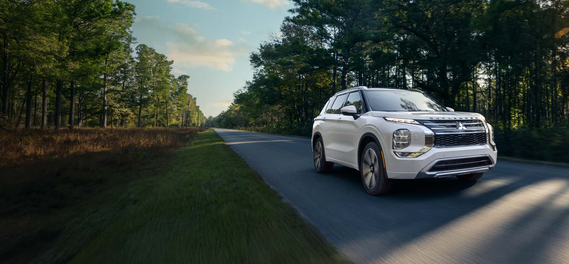 The Walser Way Ads Showing a White Mitsubishi Vehicle Driving in Northern Minnesota